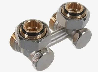 Узел нижнего подключения стальных панельных радиаторов 3/4'Fx3/4'E, угловой, для двухтрубных систем. Содержит отсечной клапан для перекрытия и балансировки.